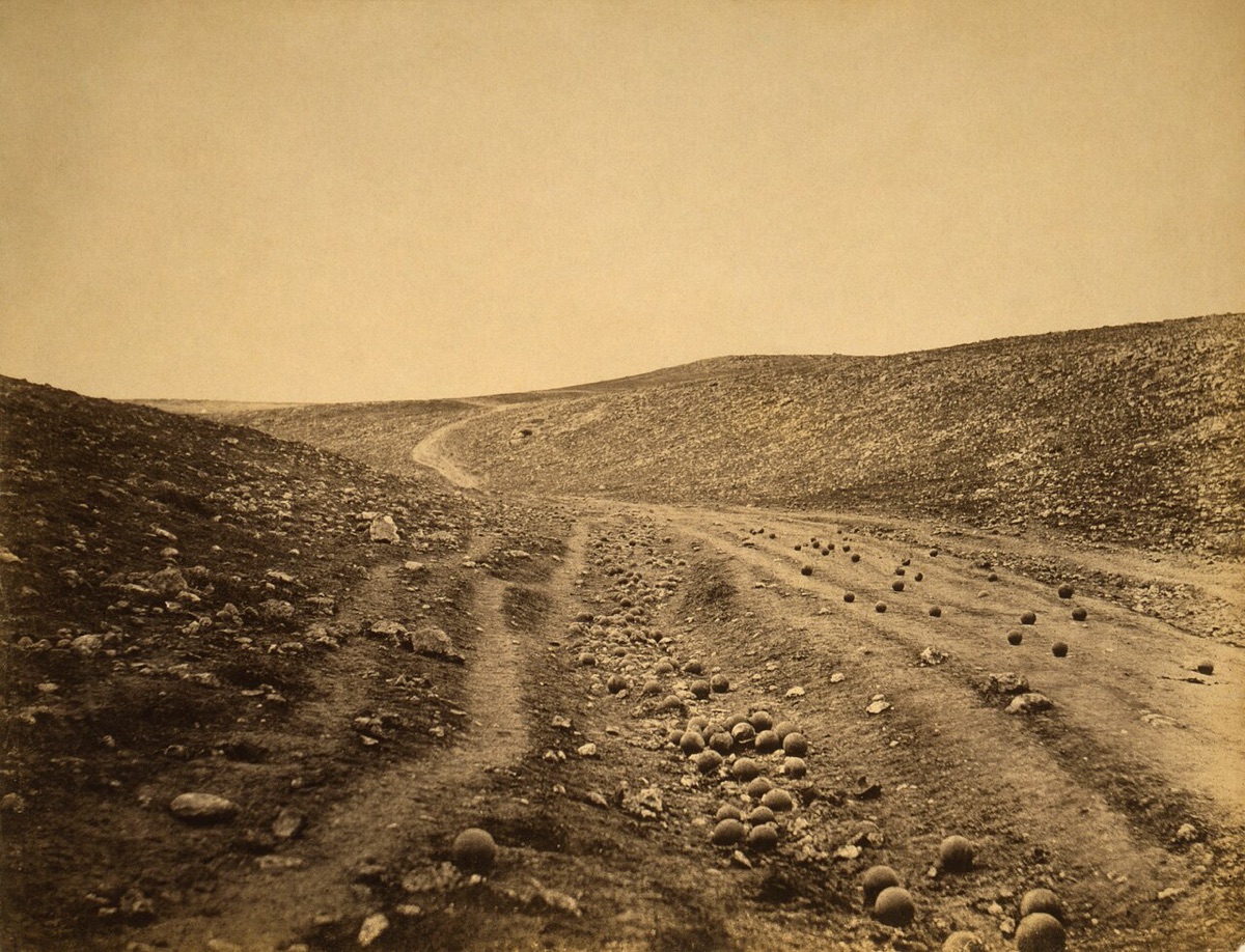 Roger Fenton photograph The Valley of the Shadow of Death, 1855, a dirt road in a ravine scattered with cannonballs